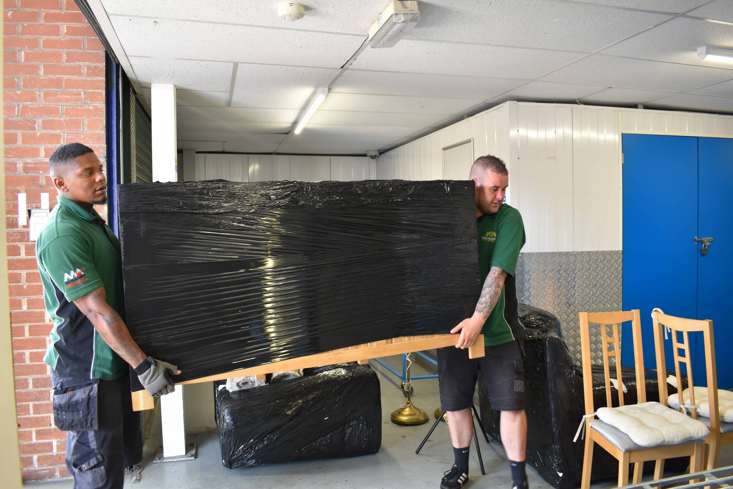 Tee's Removals team member reassembling a bed as part of their removals service